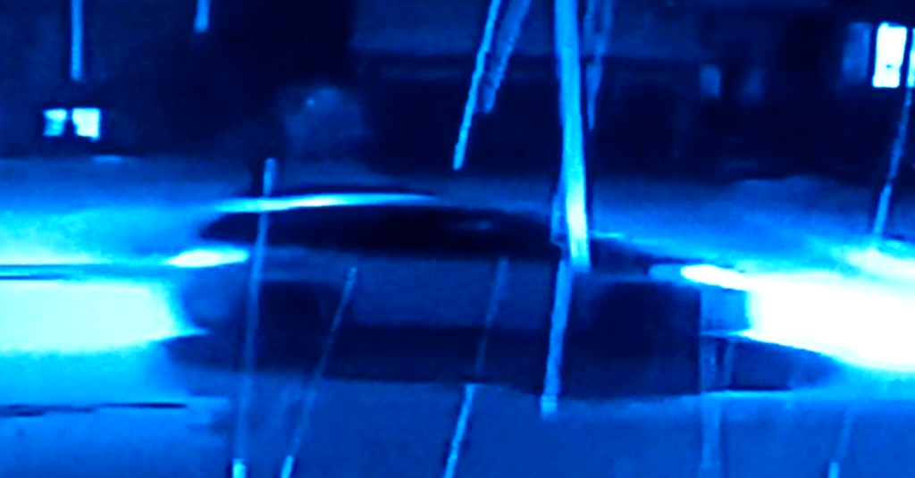 White Lexus RX driving away