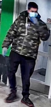 Assault suspect wearing a camouflage coat and surgical mask